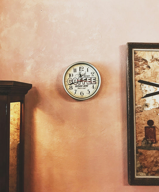 round wall clock showing time at 11:43