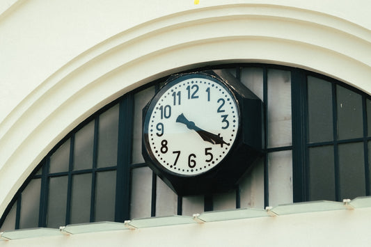 a large clock mounted to the side of a building