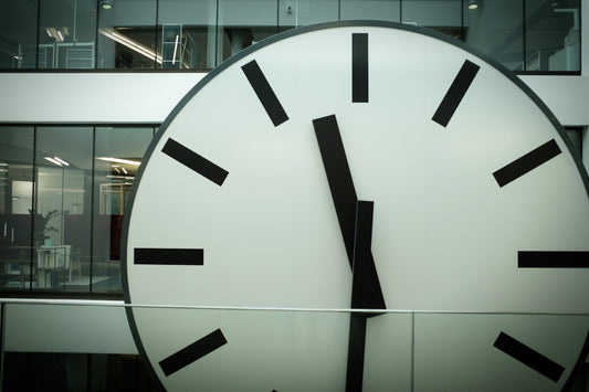 round white and black analog clock