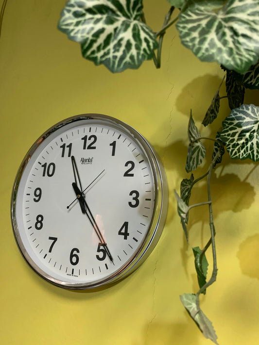 silver round analog wall clock