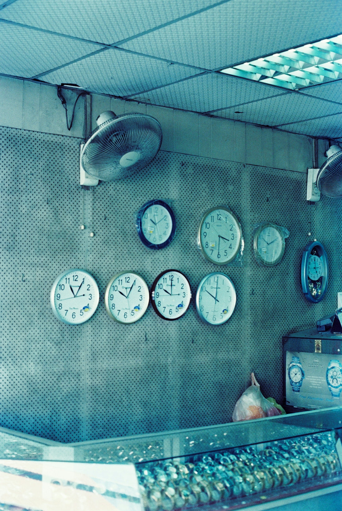 a bunch of clocks that are on the wall