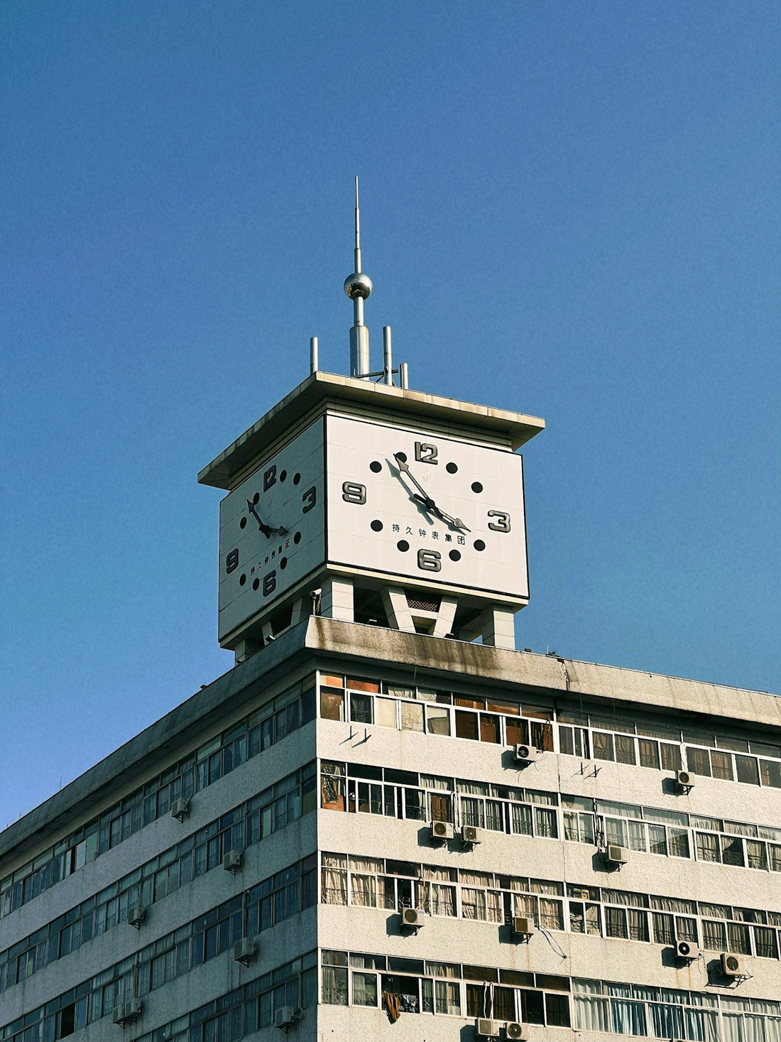 a tall building with a clock on the top of it