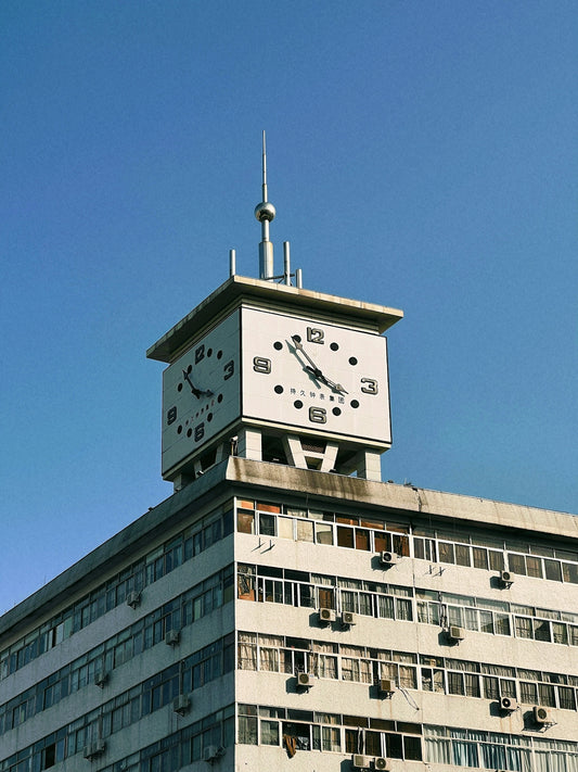 a tall building with a clock on the top of it