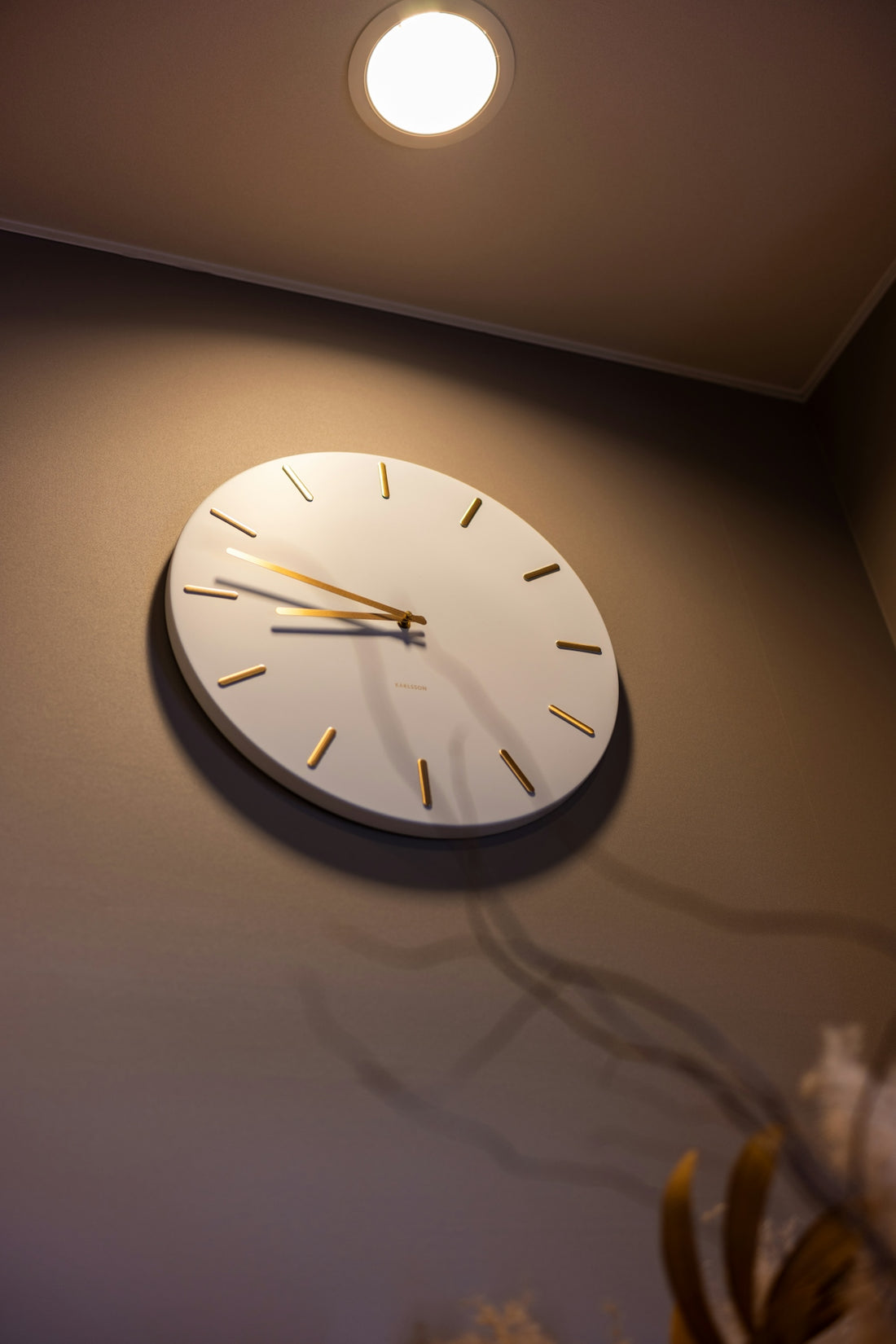 a clock mounted to the side of a wall