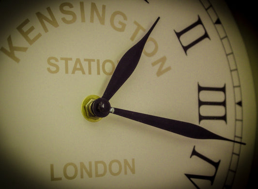 A close up of a clock face with the time on it
