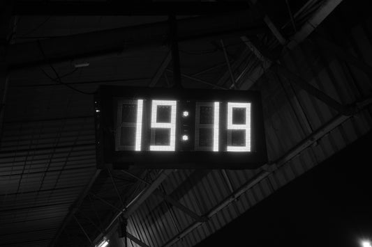 A black and white photo of a clock