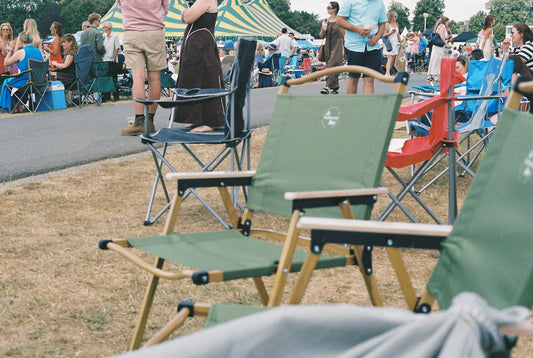 Folding chairs at a busy outdoor event